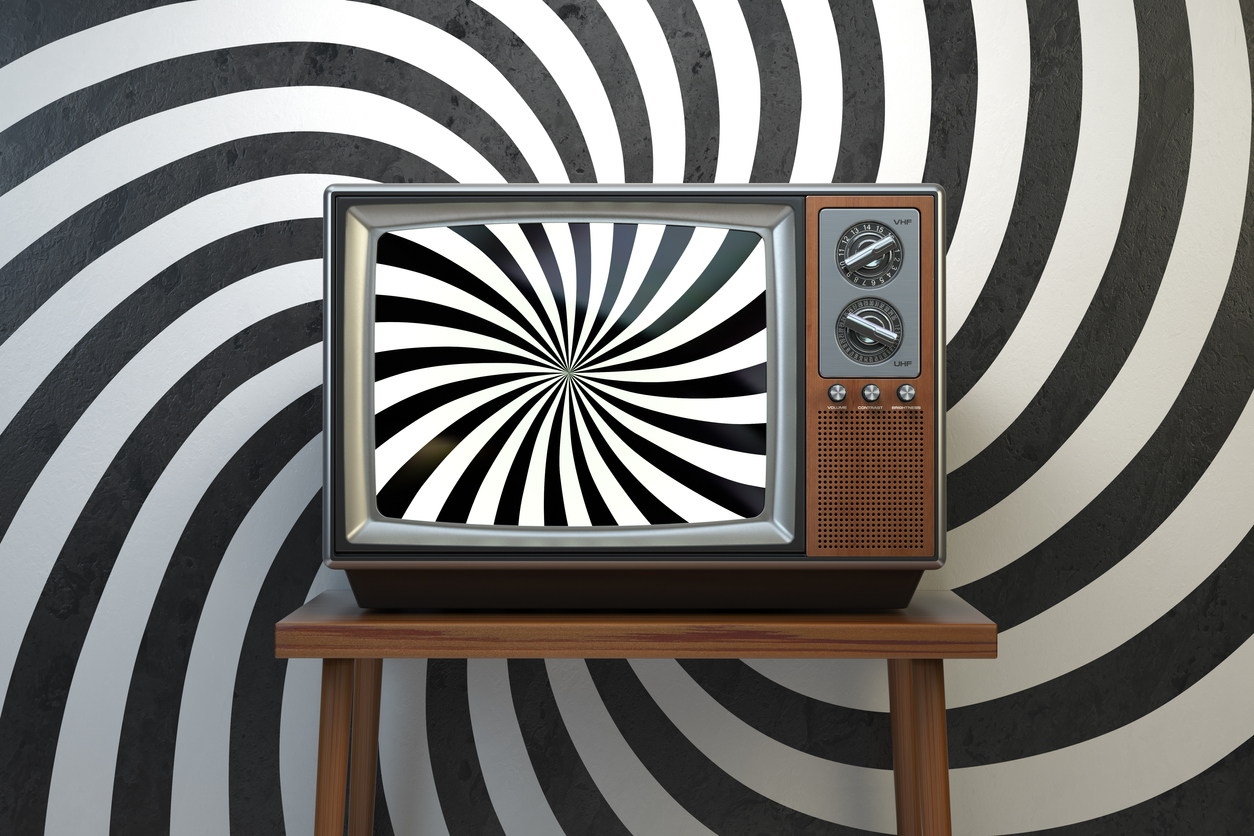 Propaganda And Brainwashing Of The Influential Mass Media Concept. Vintage TV Set With Hypnotic Spiral On The Screen.